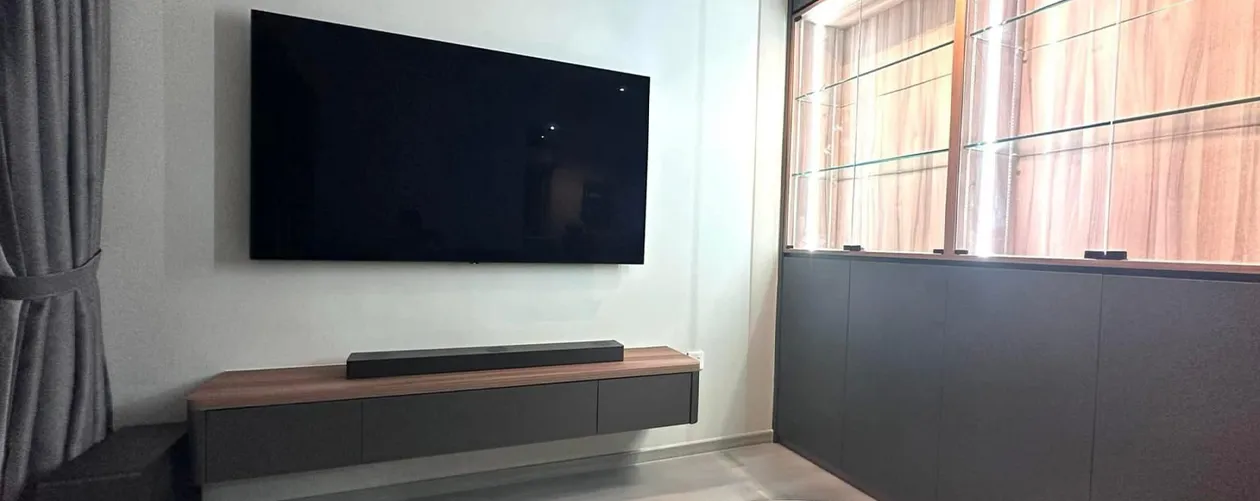 TV feature wall with integrated console and lighting by San Mu customised carpentry Singapore