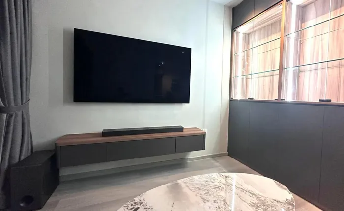 TV feature wall with integrated console and lighting by San Mu customised carpentry Singapore
