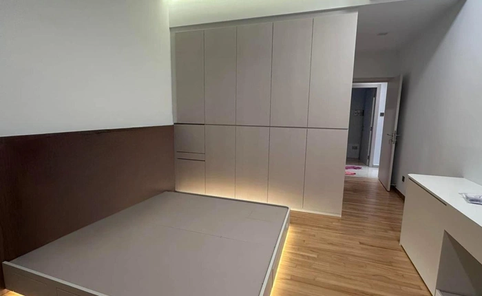 Custom wardrobe with open shelving and hanging space by San Mu interior design Singapore